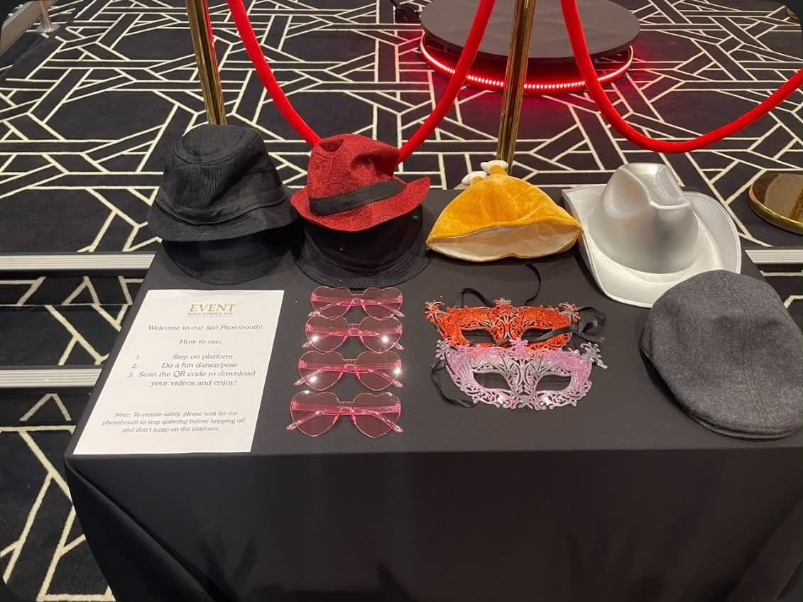 Photobooth props table with hats, masks and glasses ready for guests
